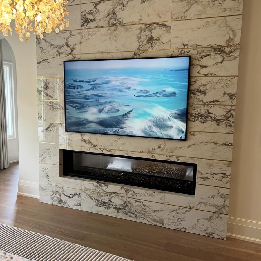 Framed TV on a marble feature wall